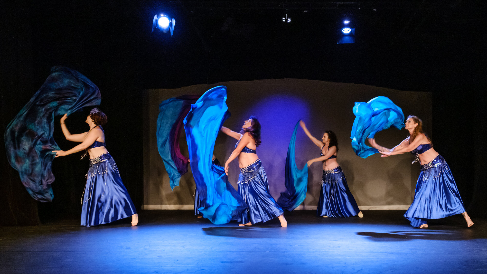 Z-Helene performs a veil dance with a group of dancers. 